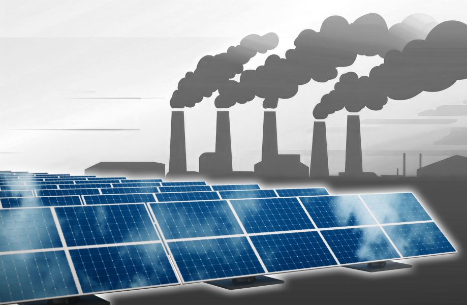 Industrial landscape featuring factories emitting smoke against a vibrant sunset backdrop.